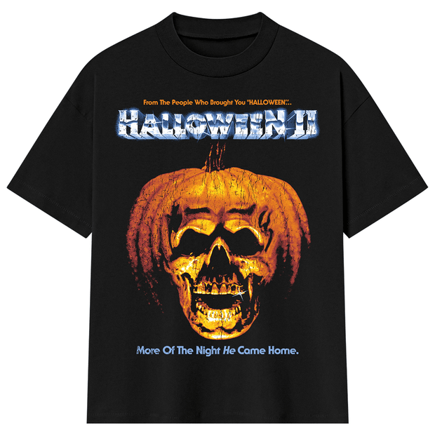 A black short-sleeve graphic t-shirt featuring a large orange jack-o ...