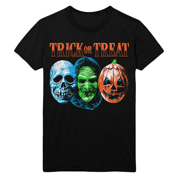 A black short-sleeve crewneck t-shirt featuring a 'Trick or Treat' Halloween graphic. The graphic displays three stylized masks and a jack-o'-lantern pumpkin in blue, green, and orange, with 'TRICK OR TREAT' written in orange text above them.