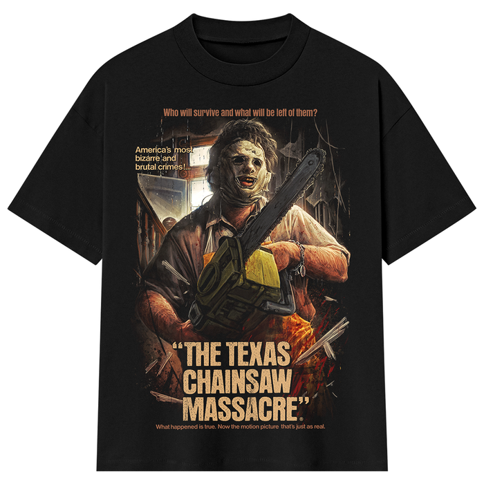 A black short-sleeve graphic T-shirt featuring a horror movie-style print of a man holding a chainsaw, with text reading 'The Texas Chainsaw Massacre' and additional quote text on a plain white background.