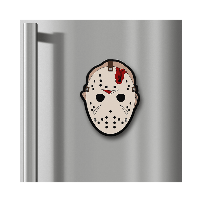 A horror-themed Jason Voorhees hockey mask magnet on a stainless steel refrigerator door, shown against a white background.