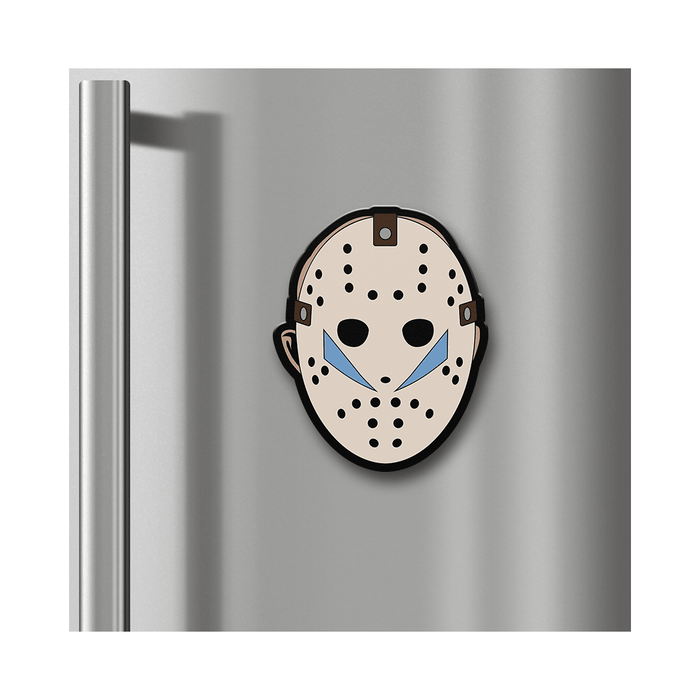 A Jason Voorhees hockey mask magnet attached to a stainless steel refrigerator door.