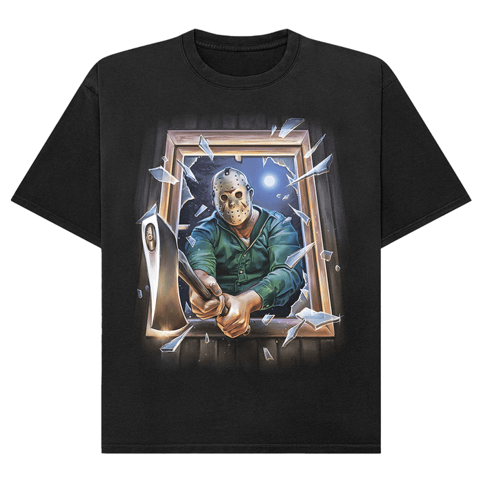 A black short-sleeve crewneck t-shirt featuring a graphic print of Jason Voorhees from Friday the 13th breaking through a window with an axe, shown against a plain white background.