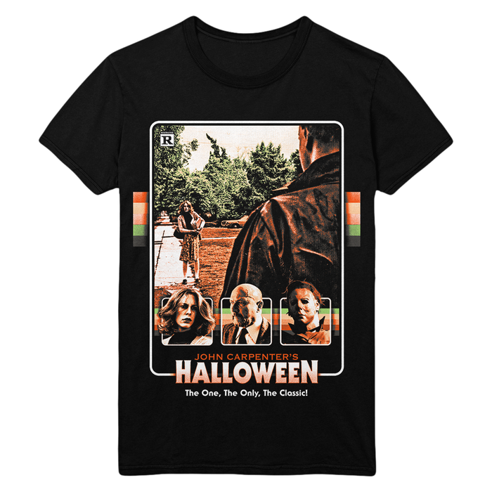 A black short-sleeve graphic t-shirt featuring a vintage-style movie poster print for John Carpenter's 'Halloween'. The graphic includes character portraits, a scene, and the movie title in bold orange and white text.